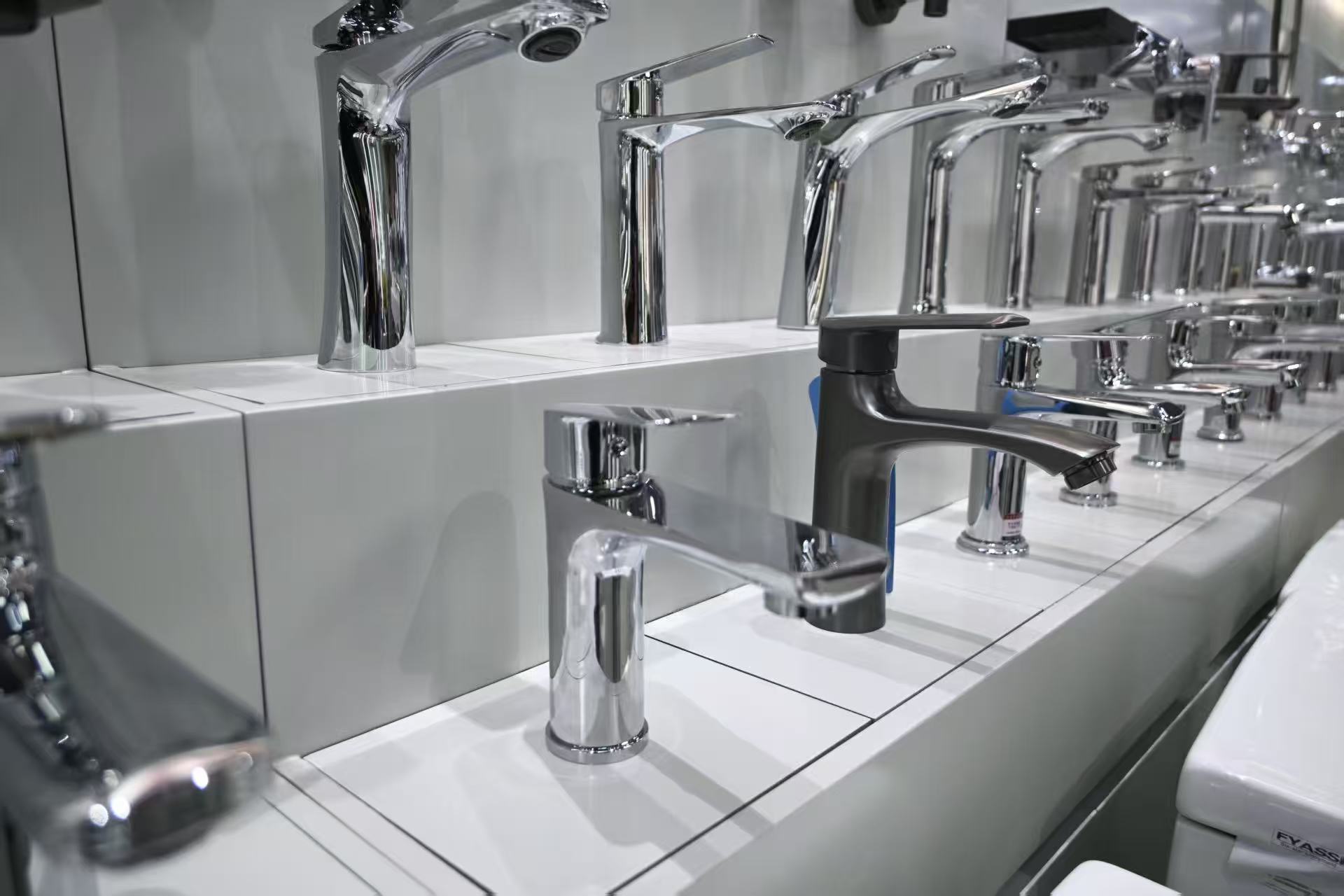 Basin faucets arranged in a product display