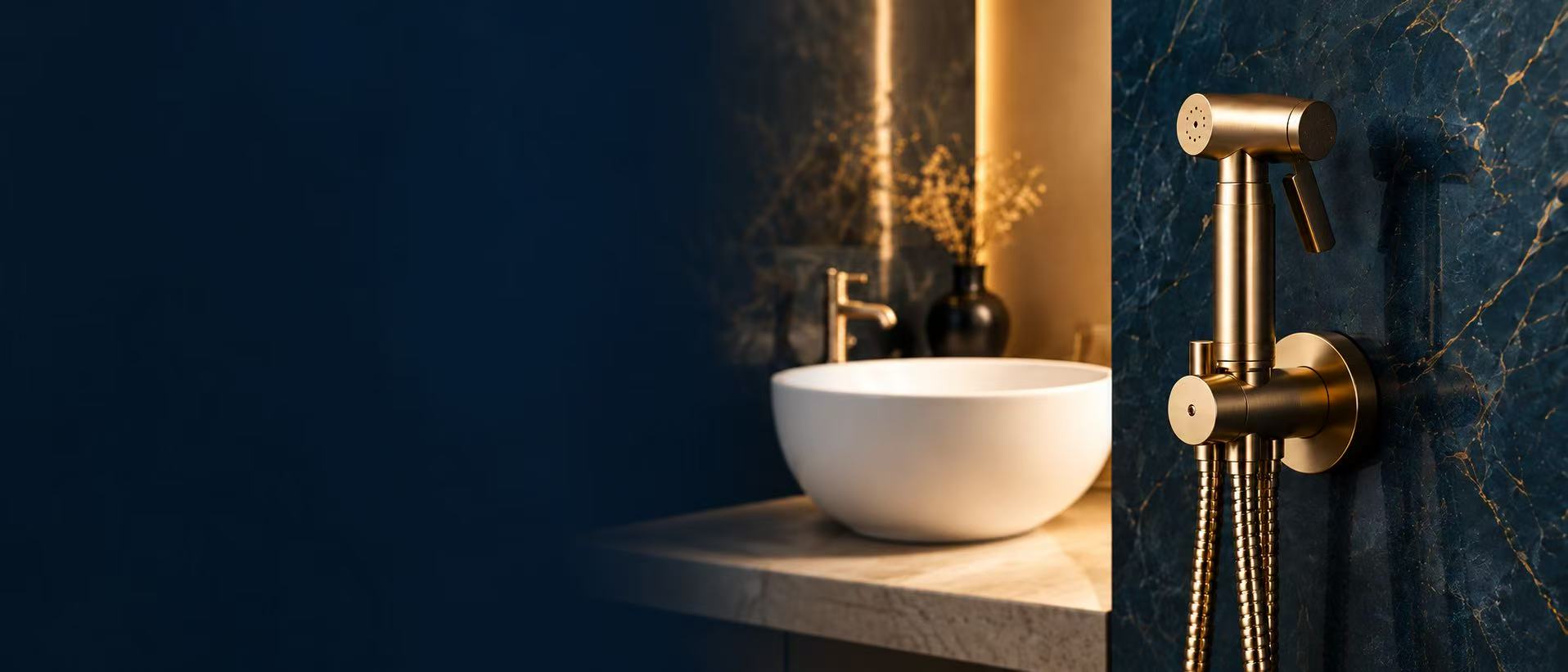 Gold Shattaf against a deep blue wall beside a basin and warm lighting