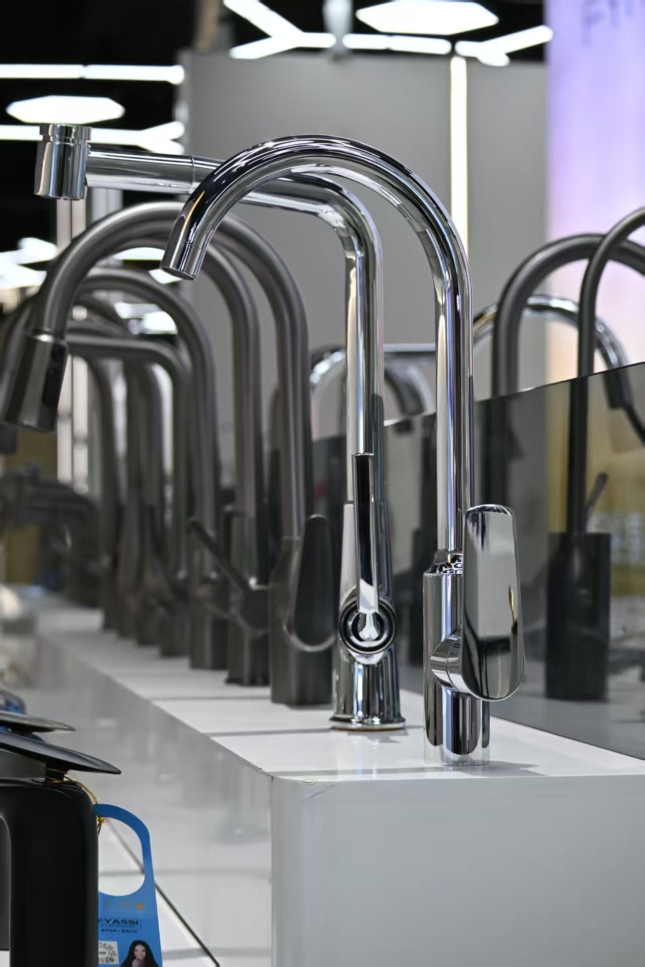 Kitchen faucets arranged in a product display